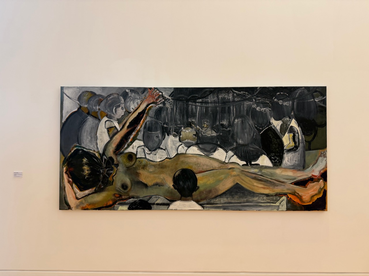 A scene composed of a body, onlookers and dark space