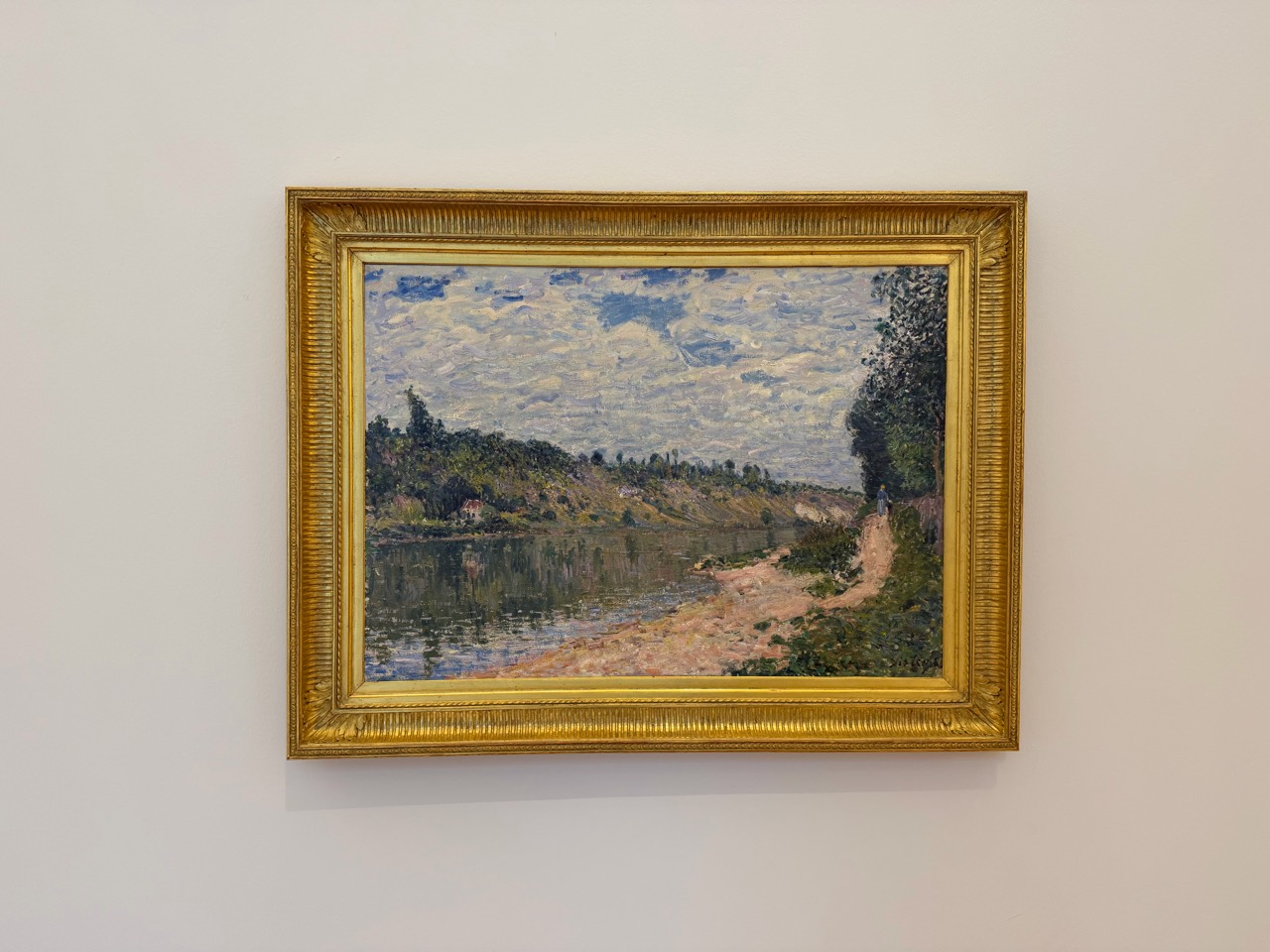 A moment of riverbank and sky formed through brushstrokes